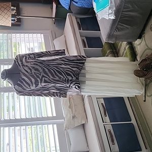 Elegant Brittany Black tunic style printed with stud decoration and sequins.